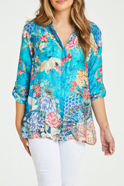 Model Tahlia wearing size S of the Floral Crane Shirt in colour Crane (Blue), from the front, cropped image