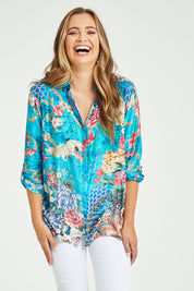 Model Tahlia wearing size S of the Floral Crane Shirt in colour Crane (Blue), from the front, cropped image