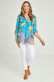 Model Tahlia wearing size S of the Floral Crane Shirt in colour Crane (Blue), from the front, showing the whole outfit