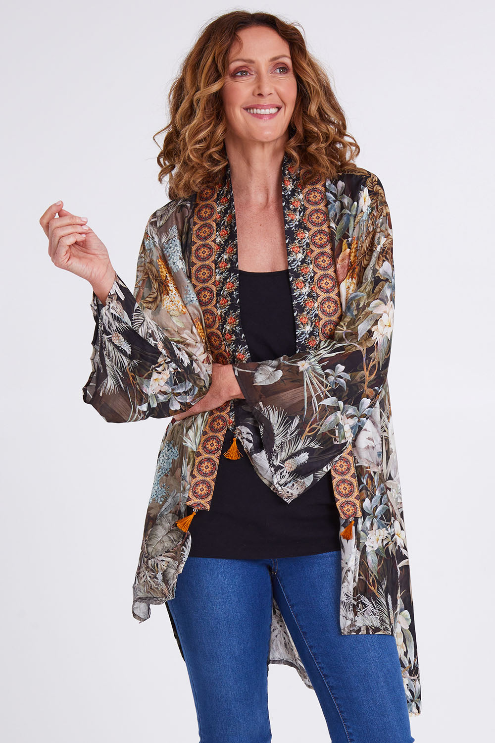 Model Emma wearing size OneSize of the Jungle Kimono in colour Jungle (Black), from the front, cropped image