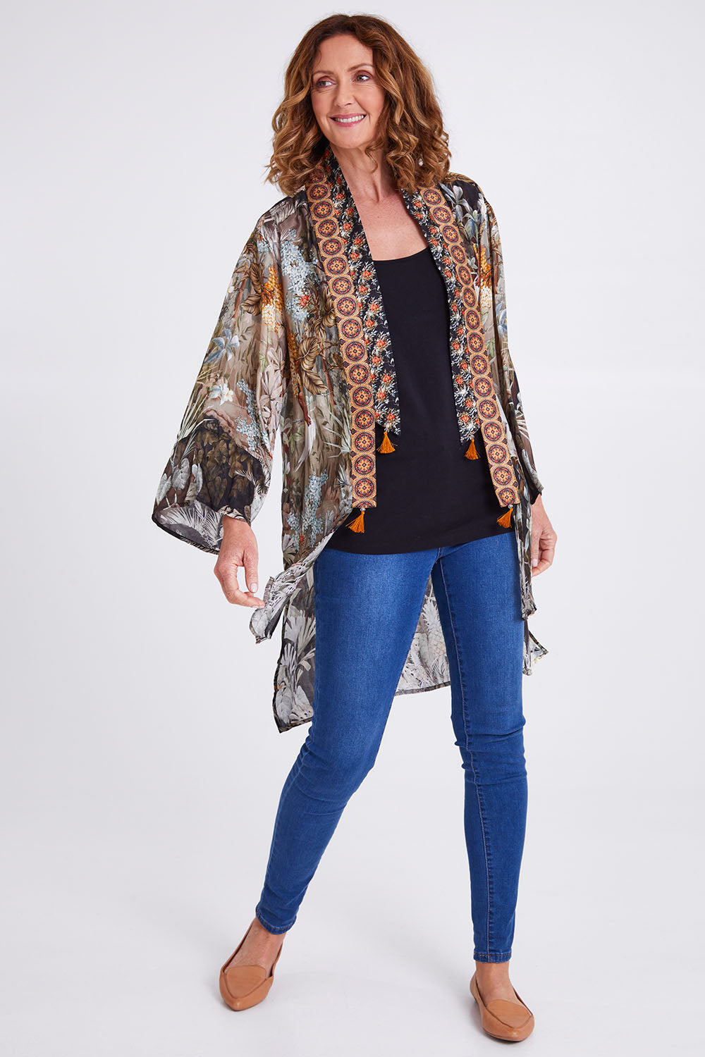 Model Emma wearing size OneSize of the Jungle Kimono in colour Jungle (Black), from the front, showing the whole outfit