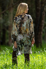 A model wearing the Jungle Kimono in colour Jungle (Black), from the back