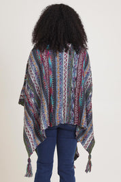 Model Ziara wearing the Lugano Wrap in colour Lugano (Blue), from the back