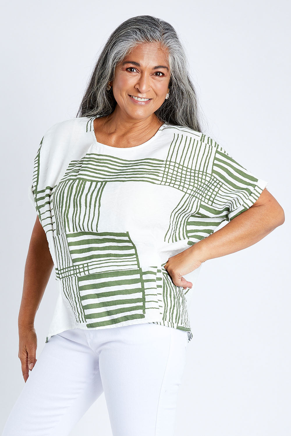 Model Nadine wearing size S of the Random Stripe Print Top in colour Khaki (Green), from the front, cropped image
