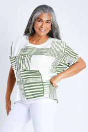 Model Nadine wearing size S of the Random Stripe Print Top in colour Khaki (Green), from the front, cropped image