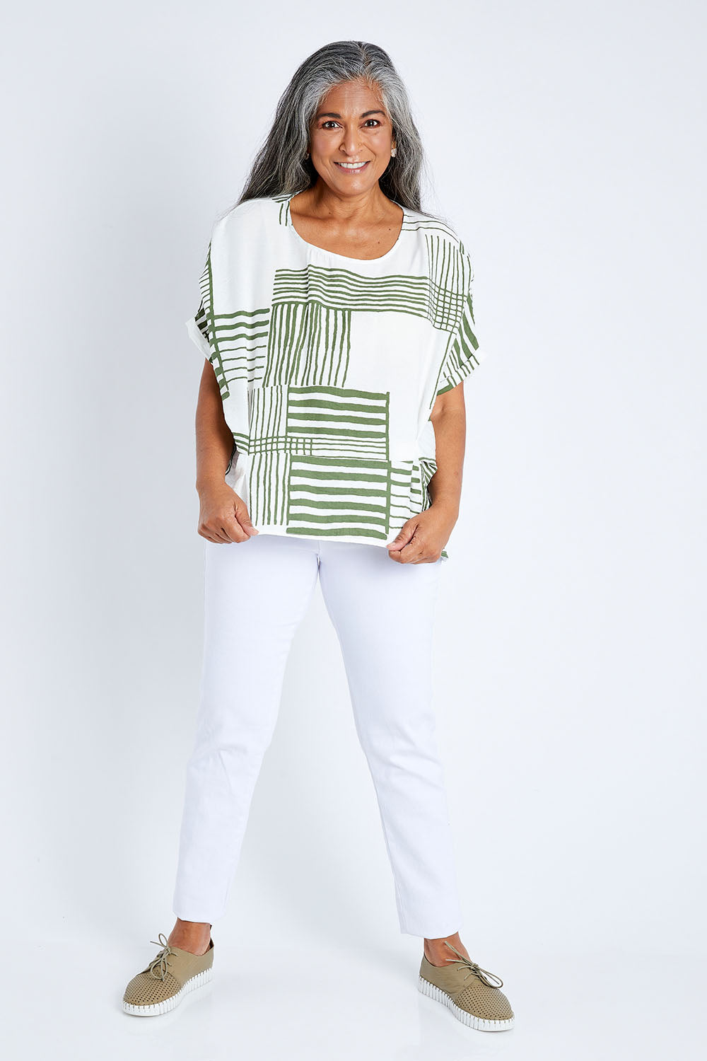 Model Nadine wearing size S of the Random Stripe Print Top in colour Khaki (Green), from the front, showing the whole outfit