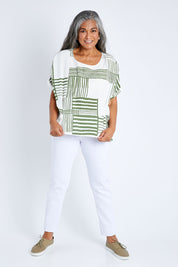 Model Nadine wearing size S of the Random Stripe Print Top in colour Khaki (Green), from the front, showing the whole outfit