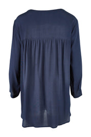 Product shot of the Madison Pocket Top in colour Navy (Blue), from the back