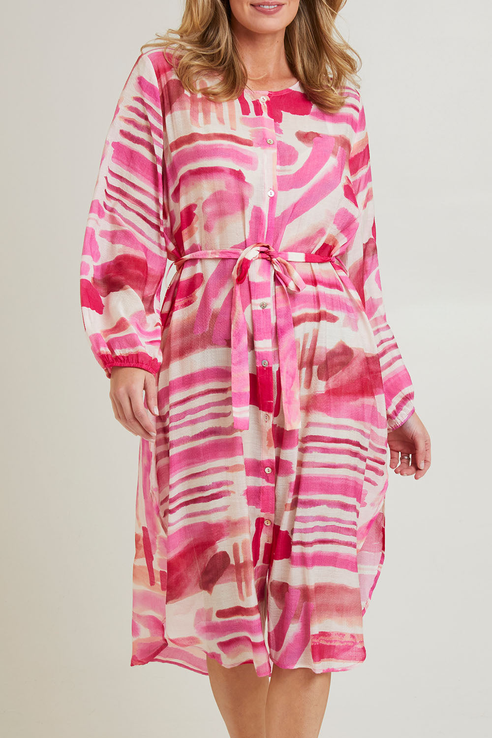 Model Grace wearing size S of the Cosmopolitan Dress in colour Pink (Pink), from the front, cropped image