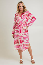 Model Grace wearing size S of the Cosmopolitan Dress in colour Pink (Pink), from the front, showing the whole outfit