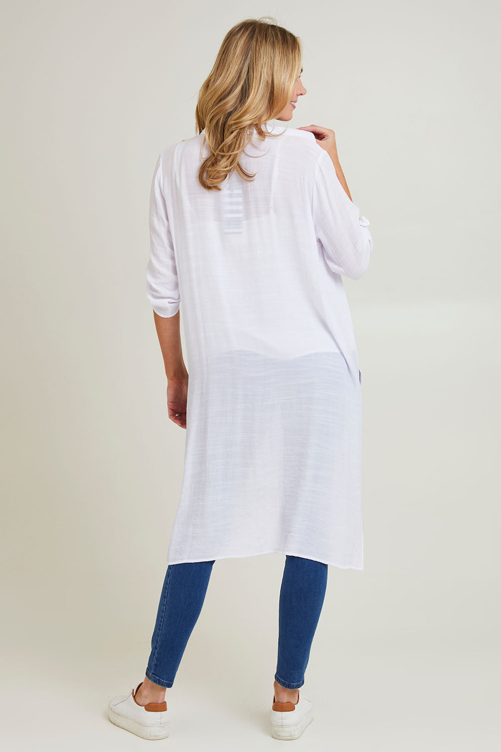 Model Grace wearing size S of the Duster Shirt in colour White (White), from the back