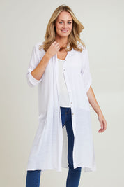 Model Grace wearing size S of the Duster Shirt in colour White (White), from the front, cropped image