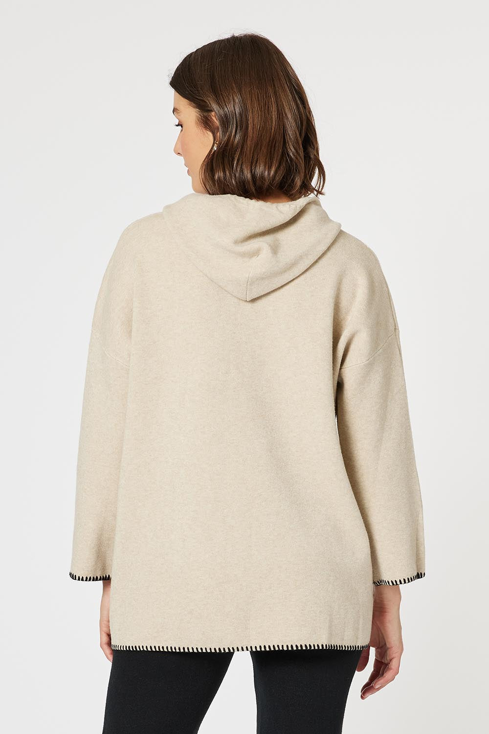 A model wearing the Cosy Knit Jumper in colour Natural, from the back
