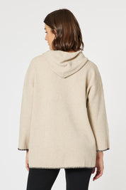 A model wearing the Cosy Knit Jumper in colour Natural, from the back