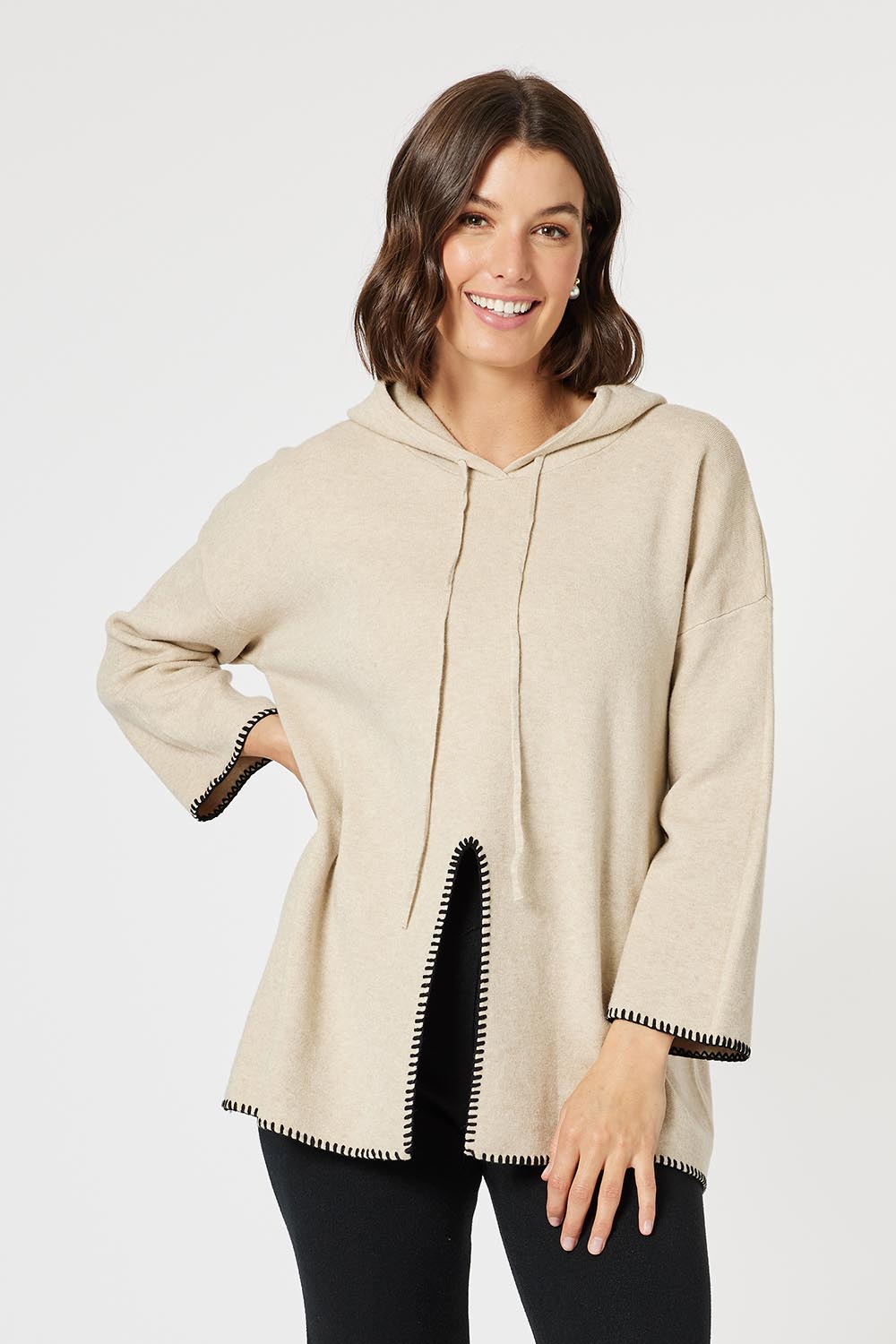 A model wearing the Cosy Knit Jumper in colour Natural, from the front, cropped image