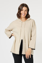 A model wearing the Cosy Knit Jumper in colour Natural, from the front, cropped image