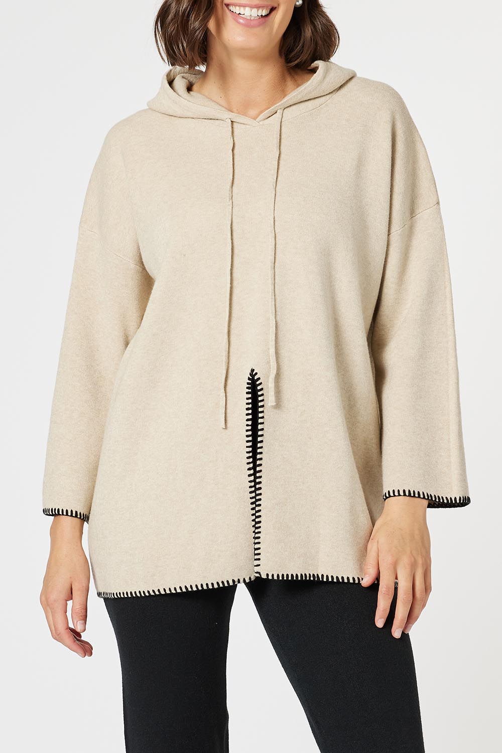 A model wearing the Cosy Knit Jumper in colour Natural, from the front, cropped image