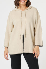 A model wearing the Cosy Knit Jumper in colour Natural, from the front, cropped image