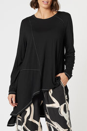 A model wearing the Artist Top in colour Black (Black), from the front, cropped image