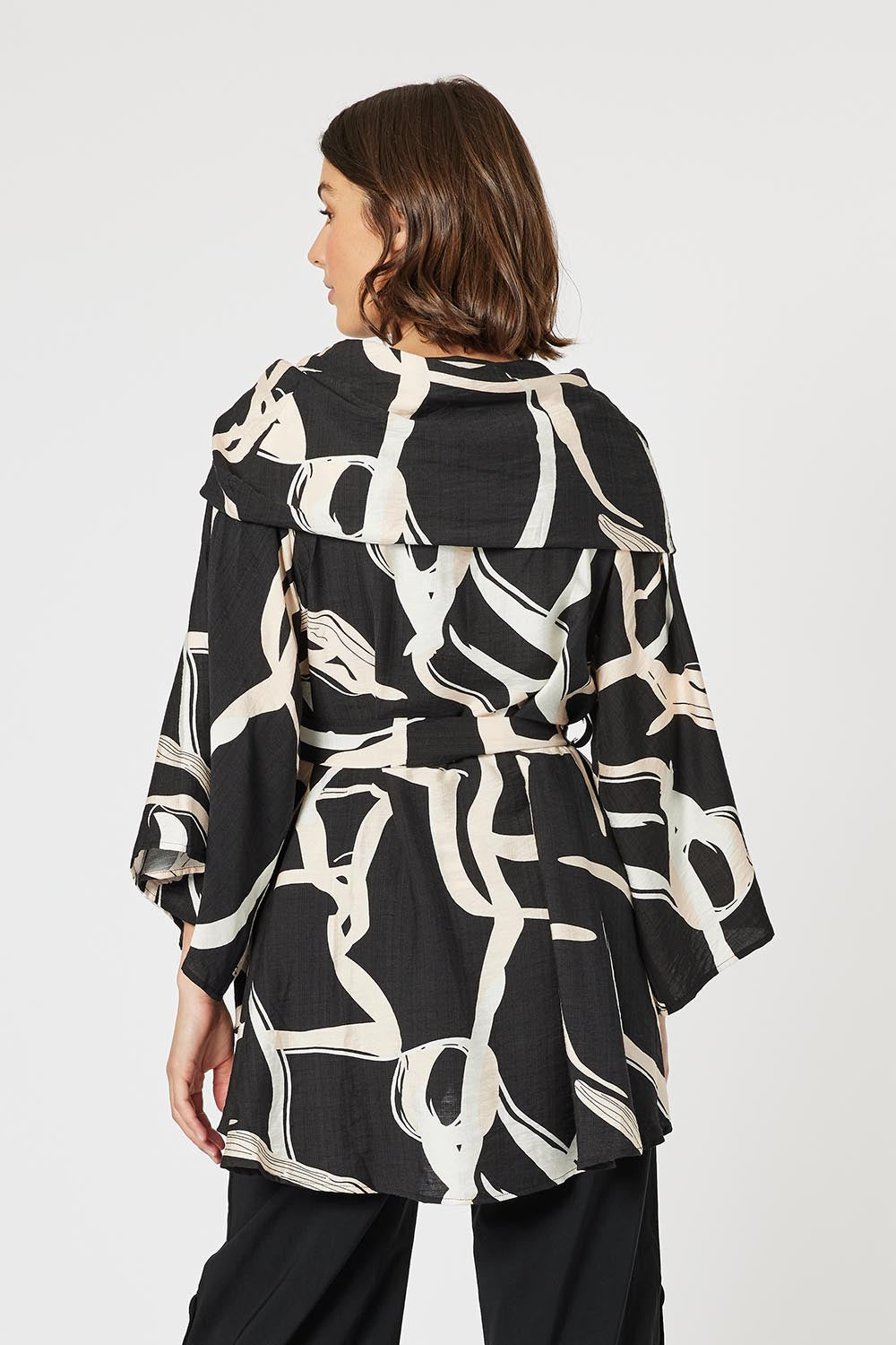 A model wearing the Matisse Top in colour Black (Black), from the back