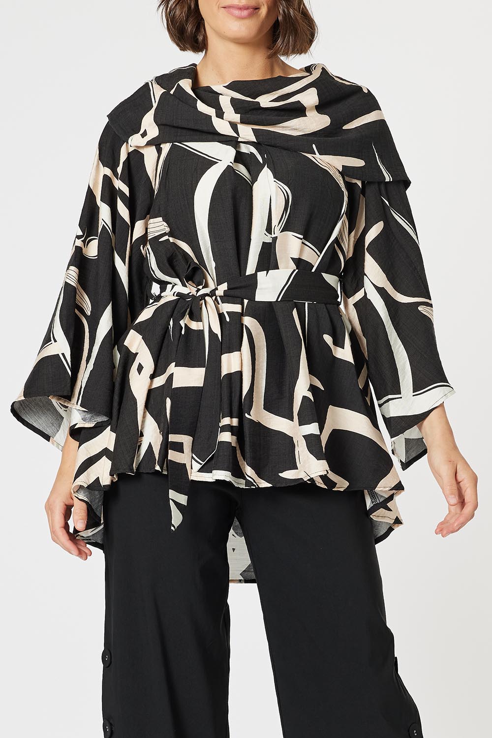 A model wearing the Matisse Top in colour Black (Black), from the front, cropped image