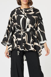 A model wearing the Matisse Top in colour Black (Black), from the front, cropped image