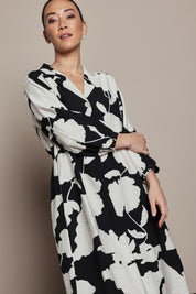 Model Katie wearing size S of the Barcelona Dress in colour Black, from the front, cropped image