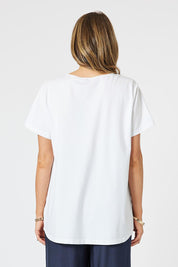 A model wearing the Geometric Linen Cotton Top in colour Navy (White), from the back
