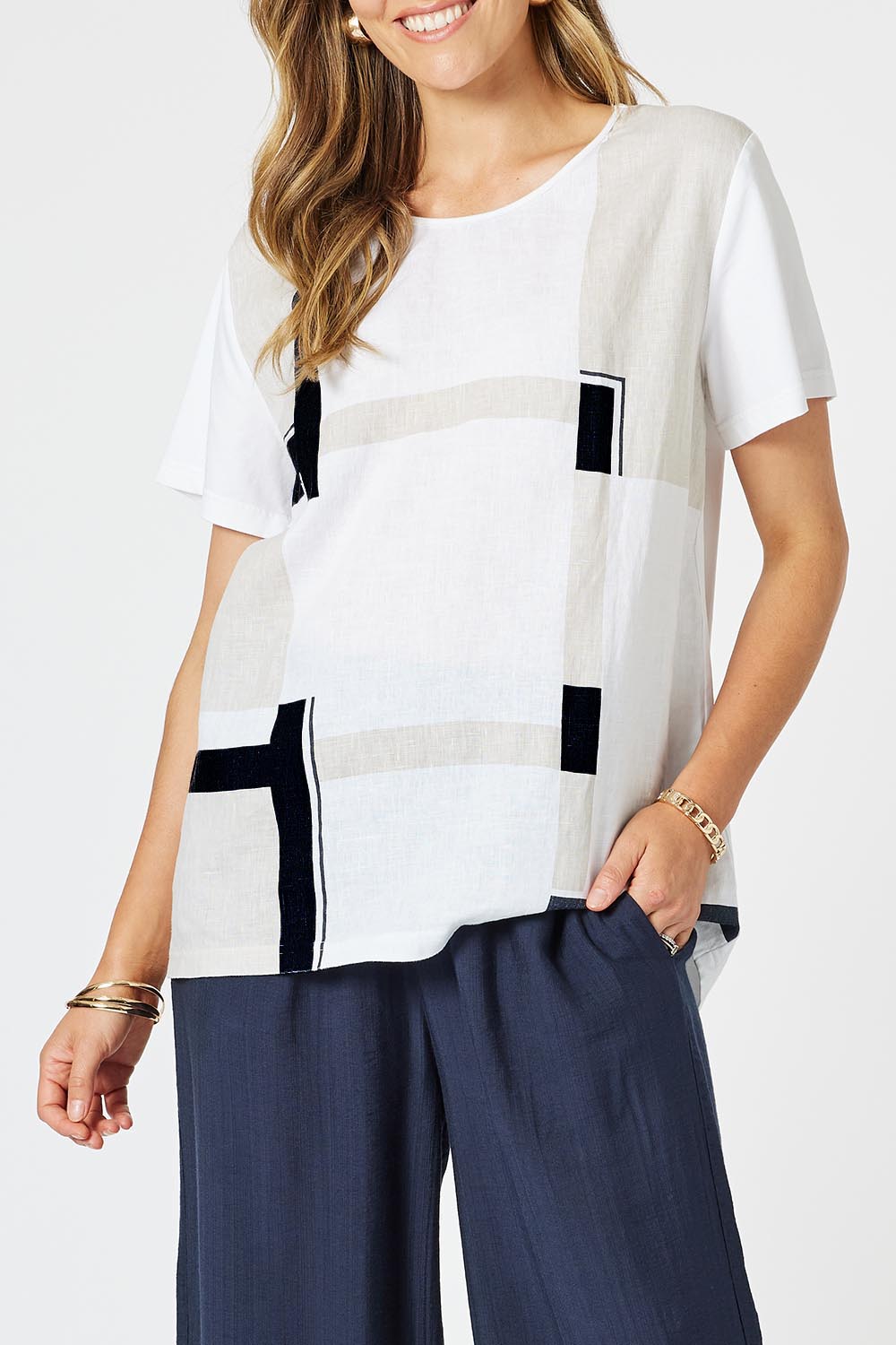A model wearing the Geometric Linen Cotton Top in colour Navy (White), from the front, cropped image