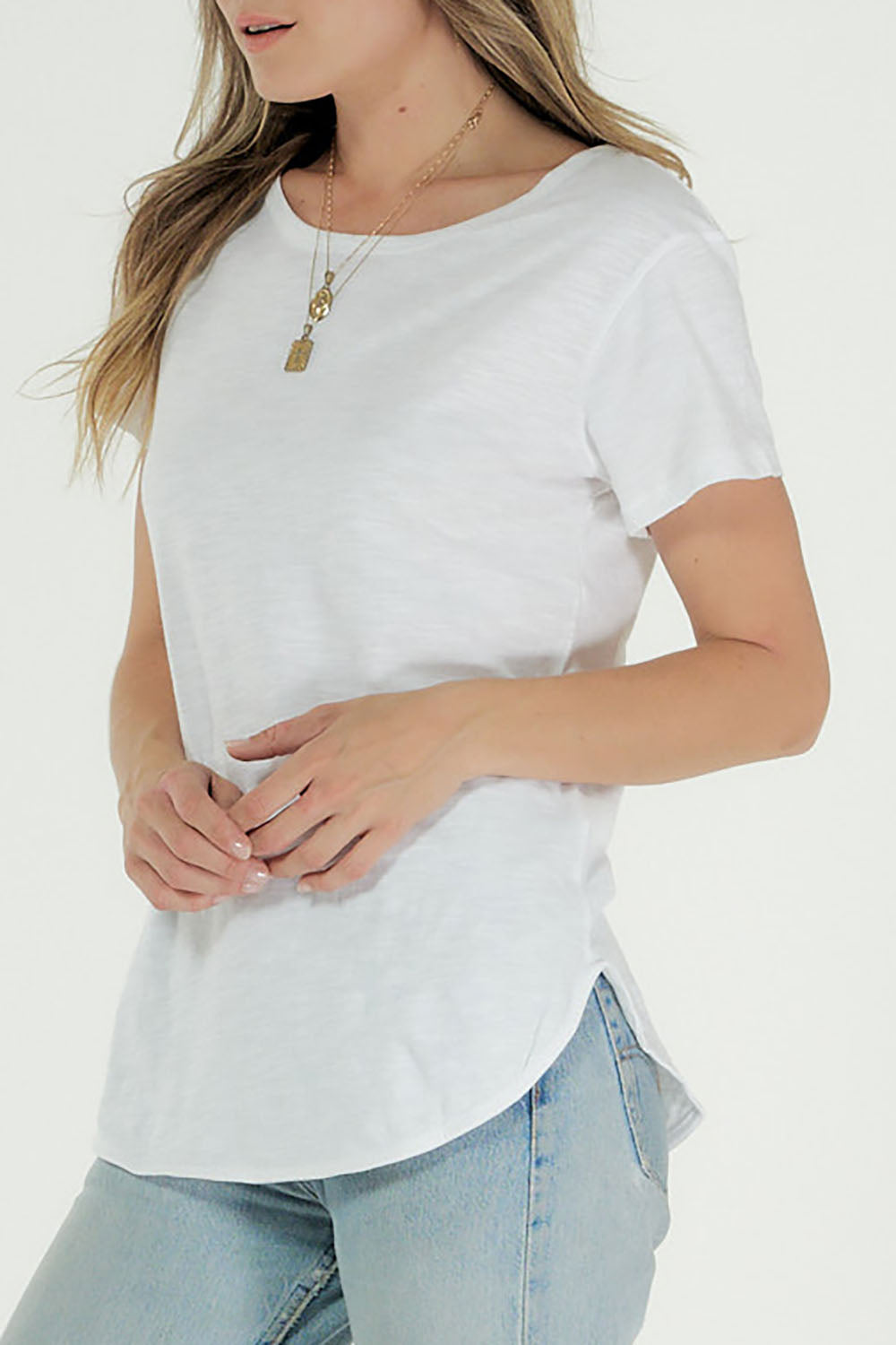 A model wearing the Organic Cotton Charlotte Tee in colour White (White), from the front, cropped image