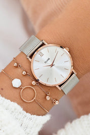 A model wearing the Minuit Mesh Rose Gold Silver Watch in colour Rosgolsilv (Metallics), from the front, showing the whole outfit