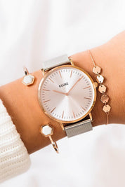 A model wearing the La Boheme Mesh Watch in colour RoseGoldSl (Metallics), from the front, showing the whole outfit