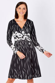 Model Perrie wearing size 10 of the Wrap Dress in colour BlackIvory (Black), from the front, cropped image