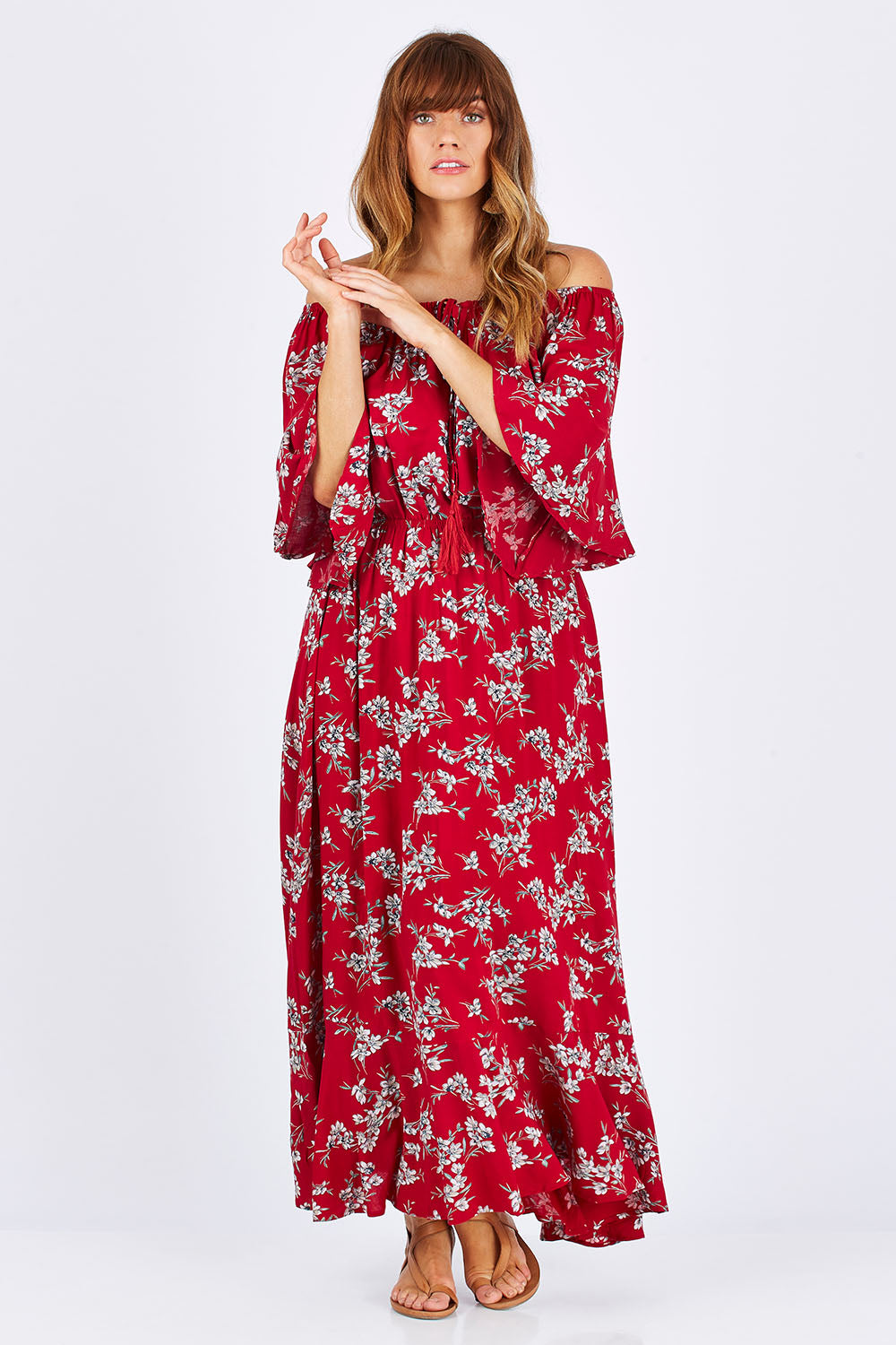 Model Laura wearing size 12 of the Floral Off The Shoulder Dress in colour Red (Red), from the front, showing the whole outfit