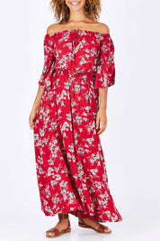 Model Summer wearing size 10 of the Floral Off The Shoulder Dress in colour Red (Red), from the front, cropped image