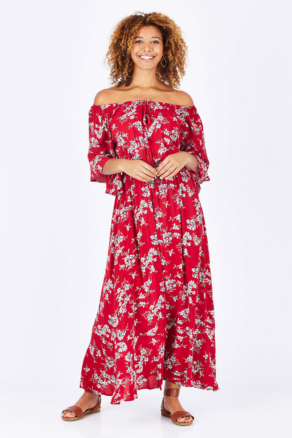 Model Summer wearing size 10 of the Floral Off The Shoulder Dress in colour Red (Red), from the front, showing the whole outfit