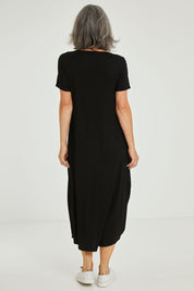Model Luisa wearing size 10 of the Summer Cotton Blend Pocket Dress in colour Black (Black), from the back
