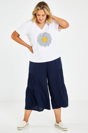 Model Jess wearing size 14 of the Gaucho Pant in colour Navy (Blue), from the front, showing the whole outfit
