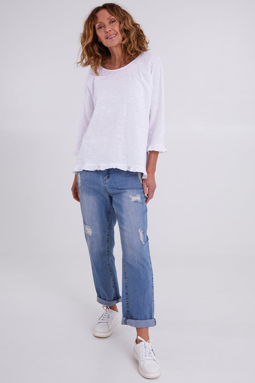 Model Emma wearing size 10 of the Ruffle 3/4 Sleeve Top in colour White (White), from the front, showing the whole outfit