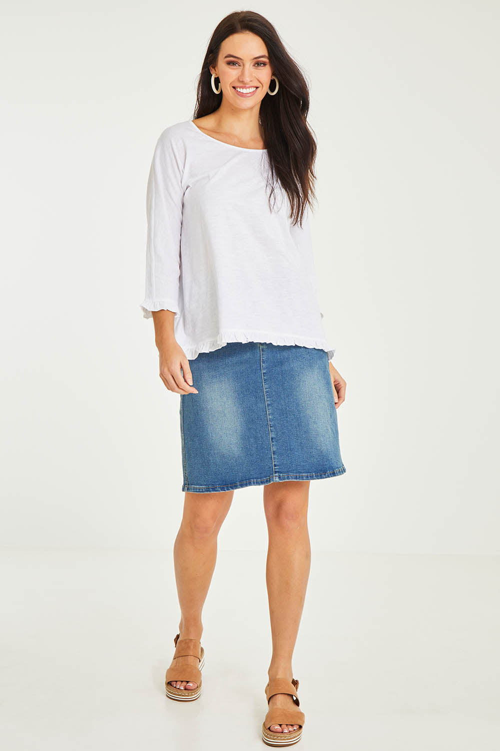 Model Stacey wearing size 10 of the Ruffle 3/4 Sleeve Top in colour White (White), from the front, showing the whole outfit