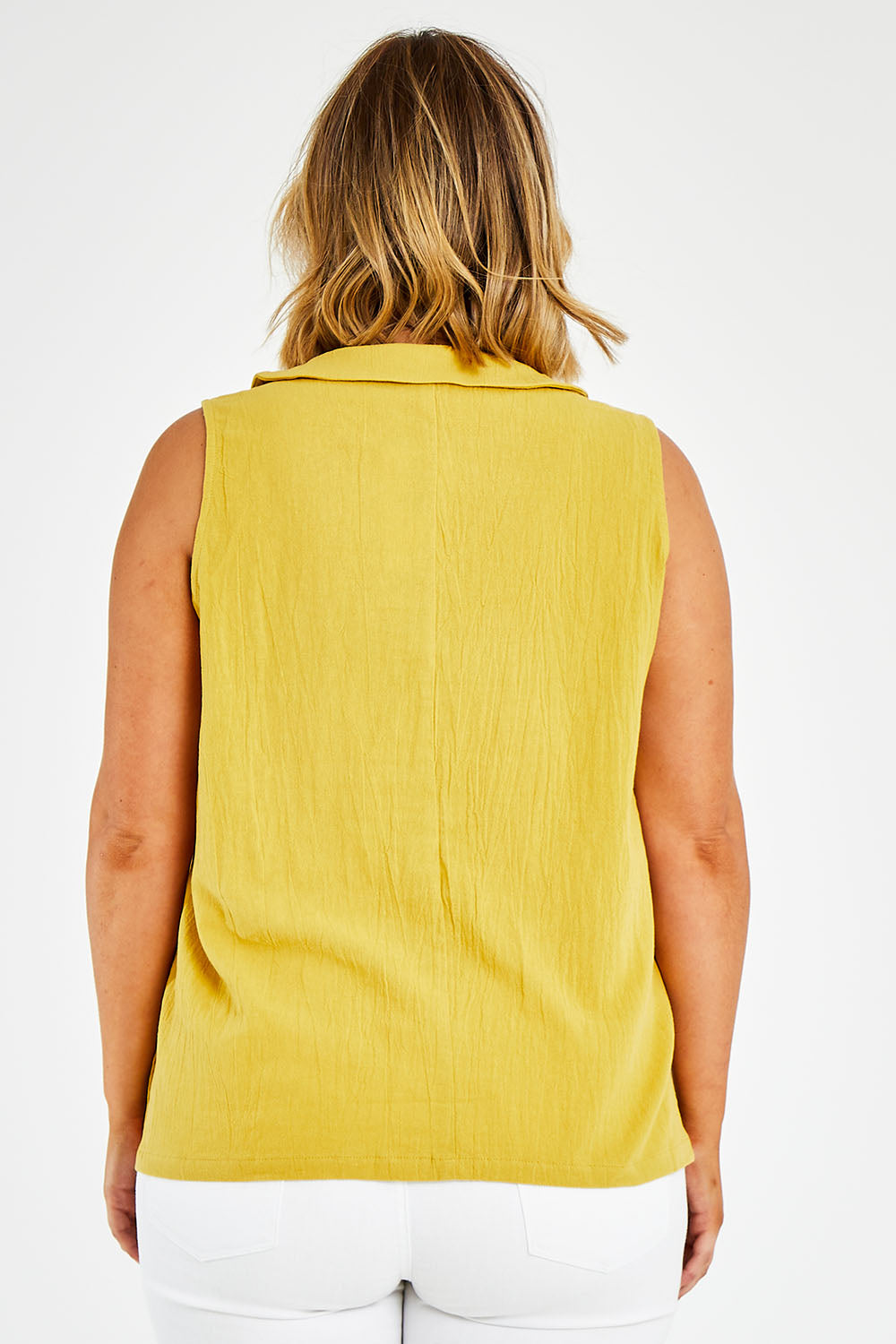 Model Jess wearing size 14 of the Upcycle Cowly Top in colour Sunflower, from the back