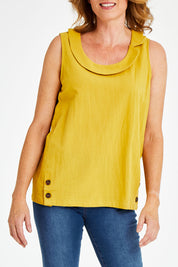 Model Naomi wearing size 10 of the Upcycle Cowly Top in colour Sunflower, from the front, cropped image