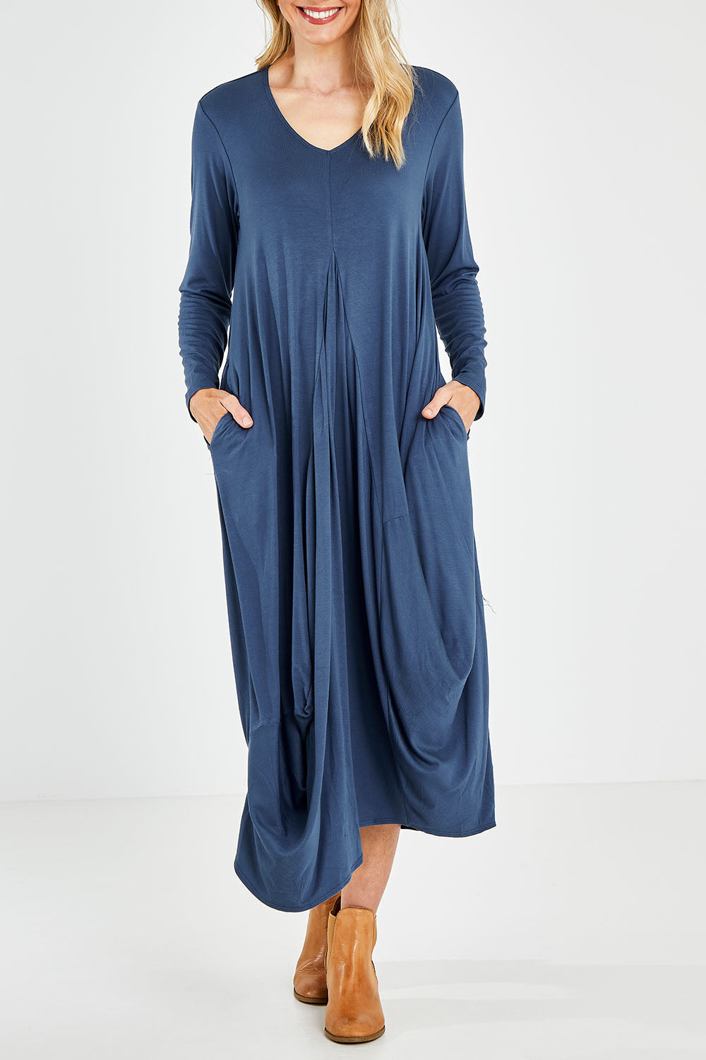 Model Kelly wearing size 10 of the Jo Jo Core Dress in colour Petrol (Blue), from the front, cropped image