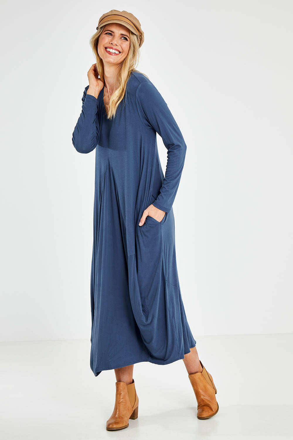 Model Kelly wearing size 10 of the Jo Jo Core Dress in colour Petrol (Blue), from the front, showing the whole outfit