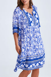 Model Monique wearing size 14 of the Sun Dress in colour Blue (Blue), from the front, cropped image