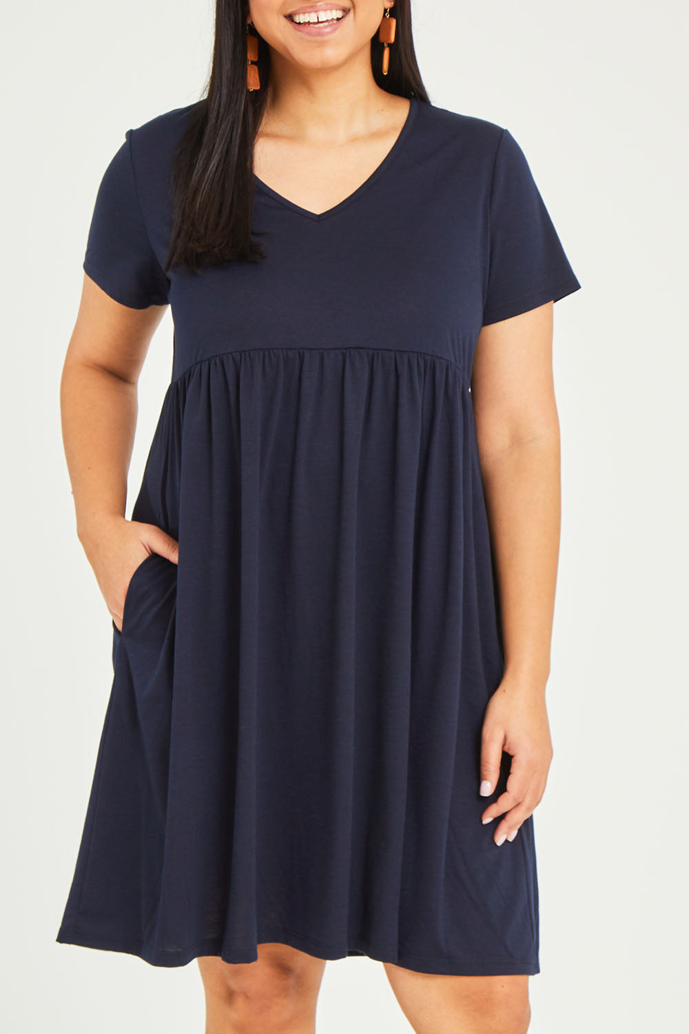 Model Terri-Leigh wearing size 14 of the Short Sleeve Holiday Dress in colour Navy (Blue), from the front, cropped image