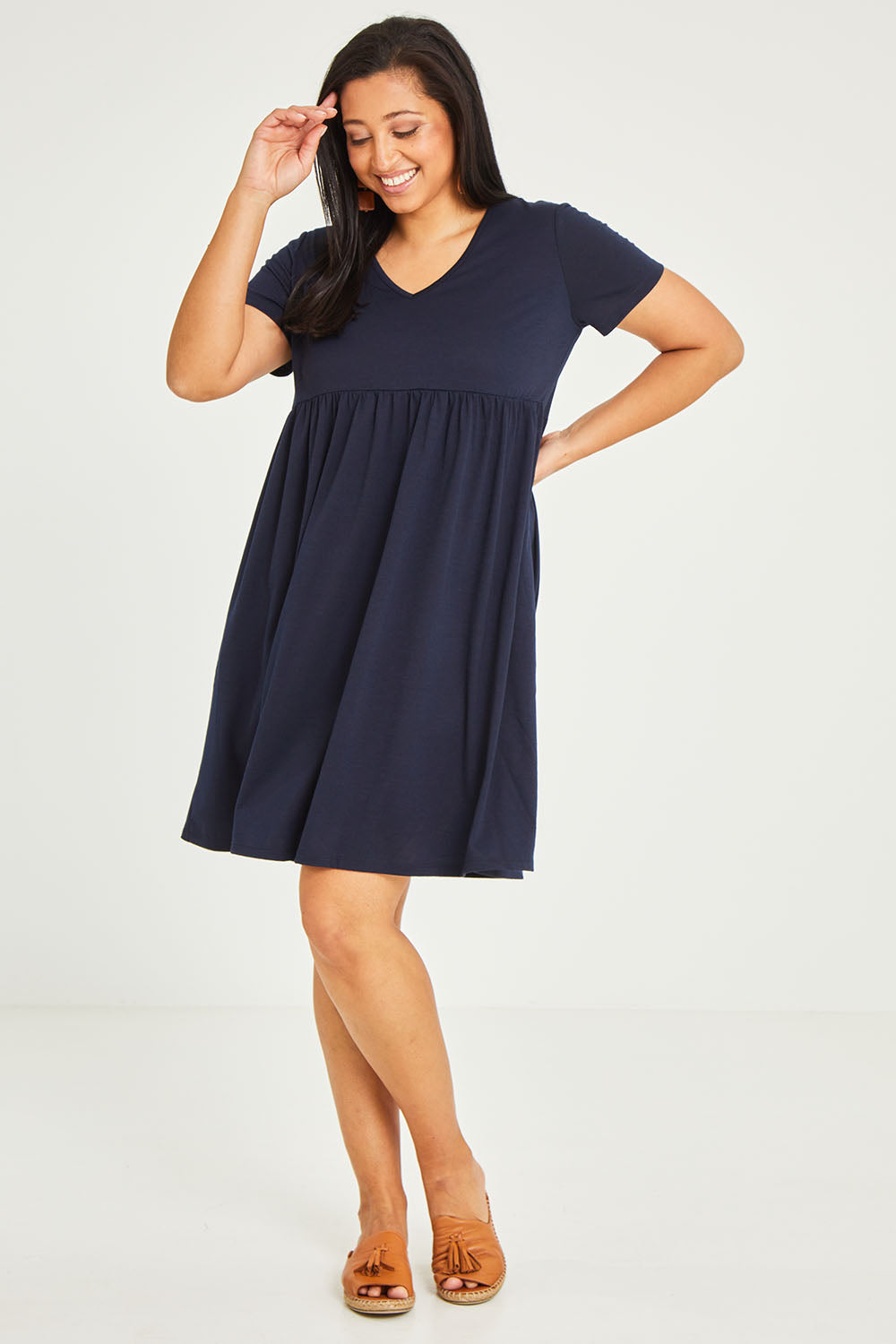 Model Terri-Leigh wearing size 14 of the Short Sleeve Holiday Dress in colour Navy (Blue), from the front, showing the whole outfit