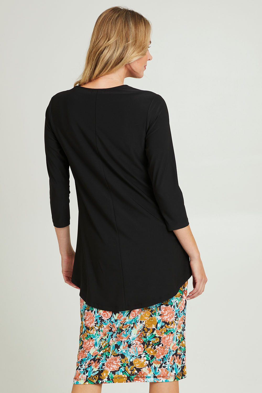 Model Grace wearing size 10 of the Forgiveness Long Dress in colour Blkfloral (Black), from the back