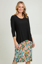Model Grace wearing size 10 of the Forgiveness Long Dress in colour Blkfloral (Black), from the front, cropped image