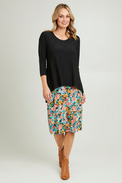 Model Grace wearing size 10 of the Forgiveness Long Dress in colour Blkfloral (Black), from the front, showing the whole outfit